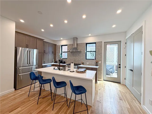 a kitchen with a table and chairs in it