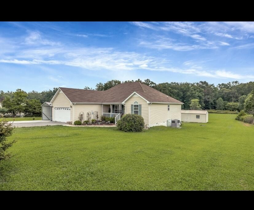 a view of a house with a big yard
