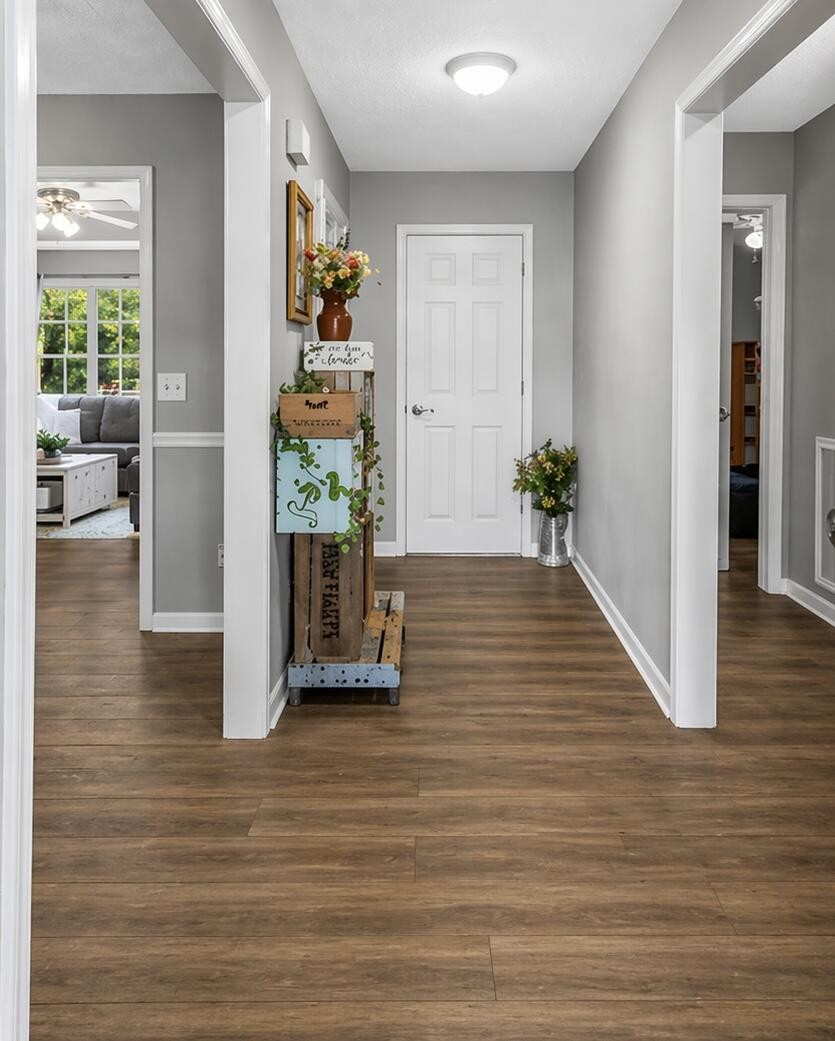 272 Jacoby Drive Manchester, TN 37355 - Photo 2 of 21 a view of a hallway with wooden floor and windows