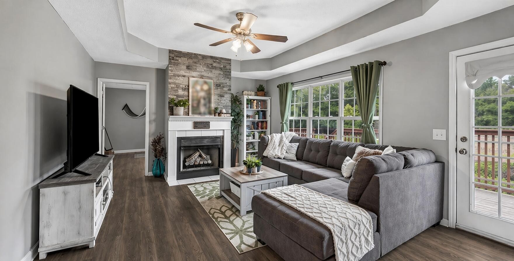 272 Jacoby Drive Manchester, TN 37355 - Photo 7 of 21 a living room with furniture a flat screen tv and a fireplace