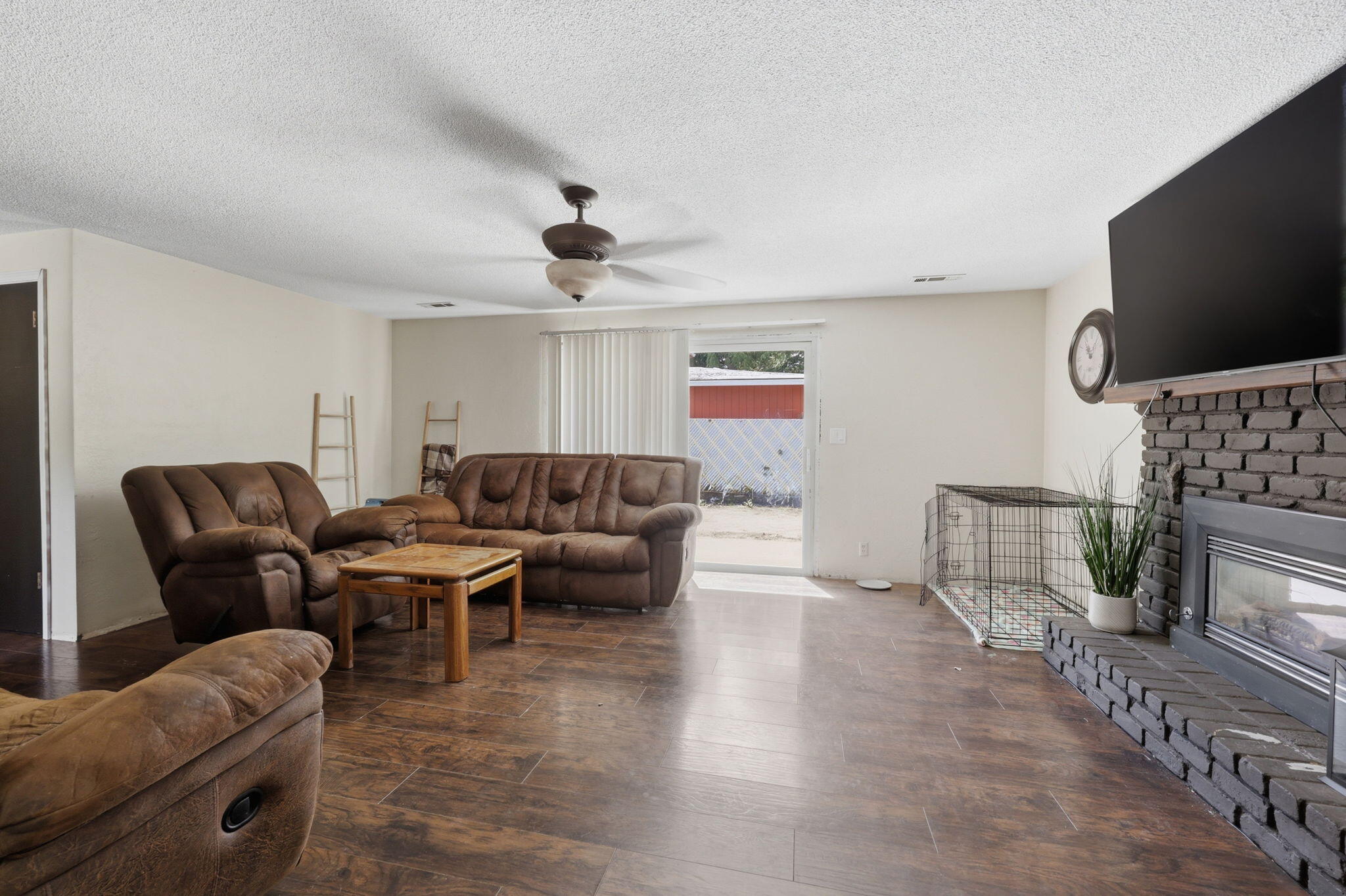 102 Elm Street Phoenix, OR 97535 - Photo 12 of 28 a living room with furniture a flat screen tv and a fireplace