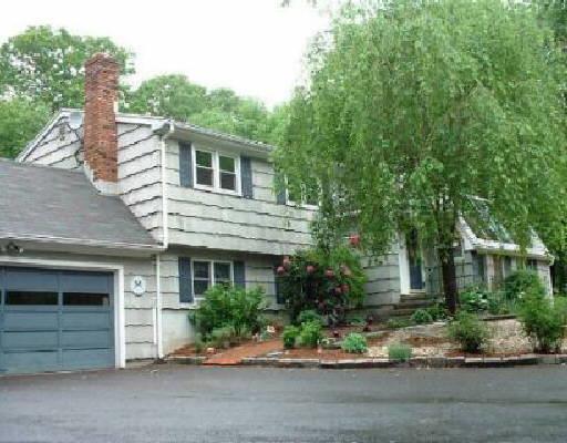 163 Mohegan Road Shelton, CT 06484 - Photo 1 of 1 a front view of a house with a garden