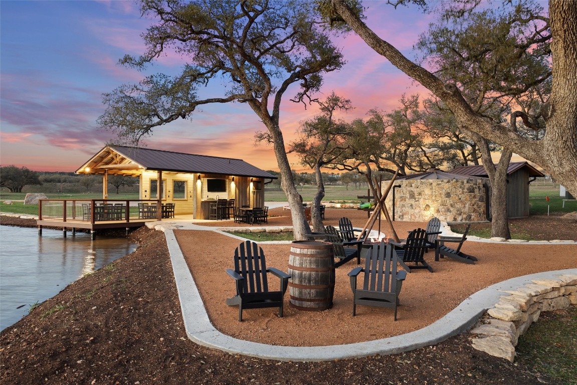 a view of a house with swimming pool and sitting area