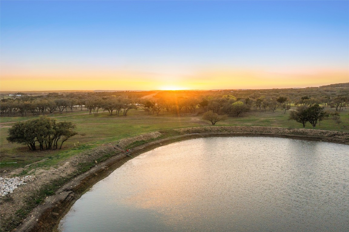 3516 Mt Sharp Road, Unit 23 Wimberley, TX 78676 - Photo 17 of 40 a view of a lake with a city