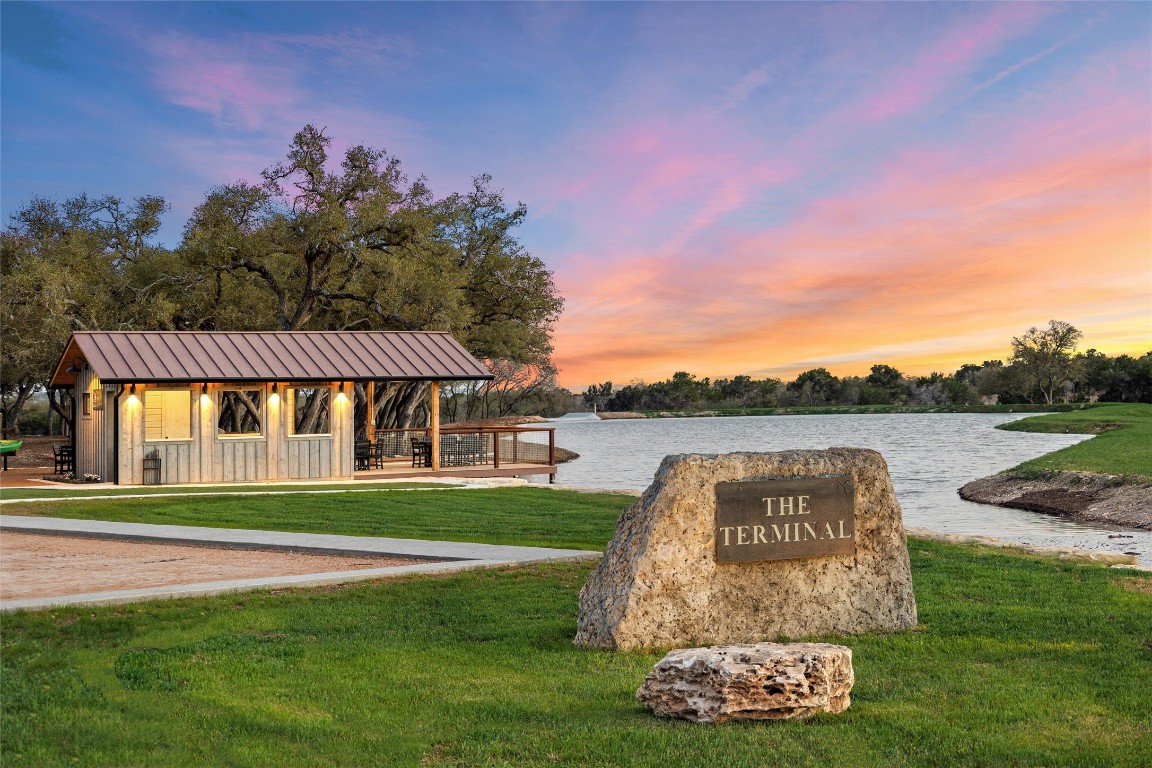 3516 Mt Sharp Road, Unit 23 Wimberley, TX 78676 - Photo 23 of 40 a view of a house with a yard