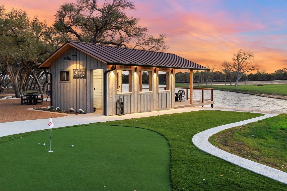 3516 Mt Sharp Road, Unit 23 Wimberley, TX 78676 - Photo 24 of 40 a view of a house with a yard deck and a garden