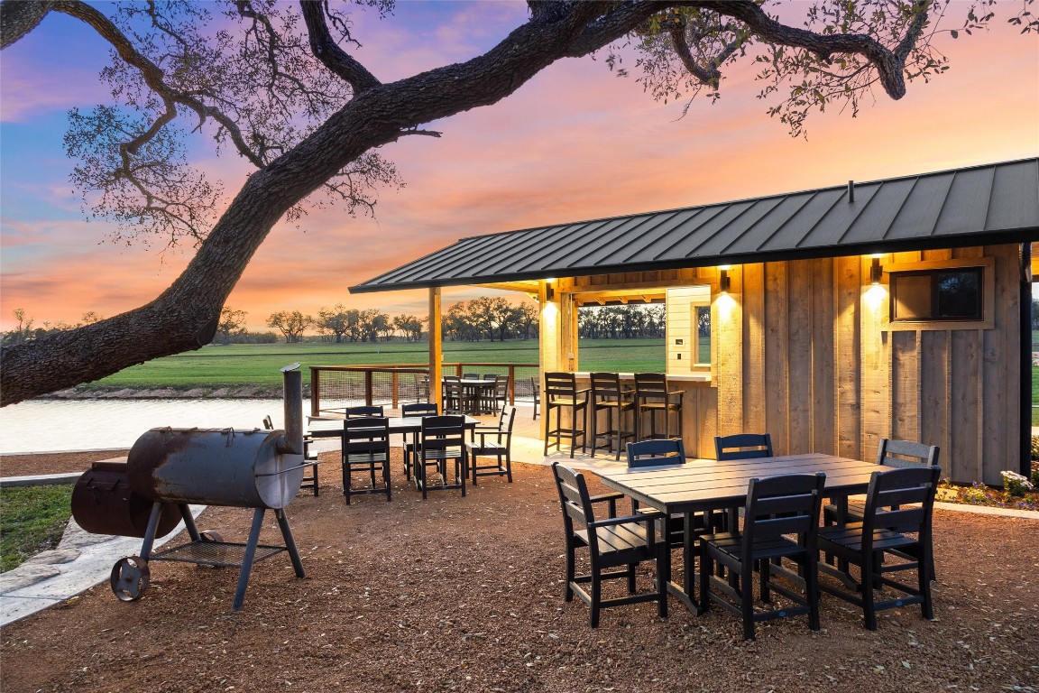 3516 Mt Sharp Road, Unit 23 Wimberley, TX 78676 - Photo 25 of 40 a view of a patio with table and chairs