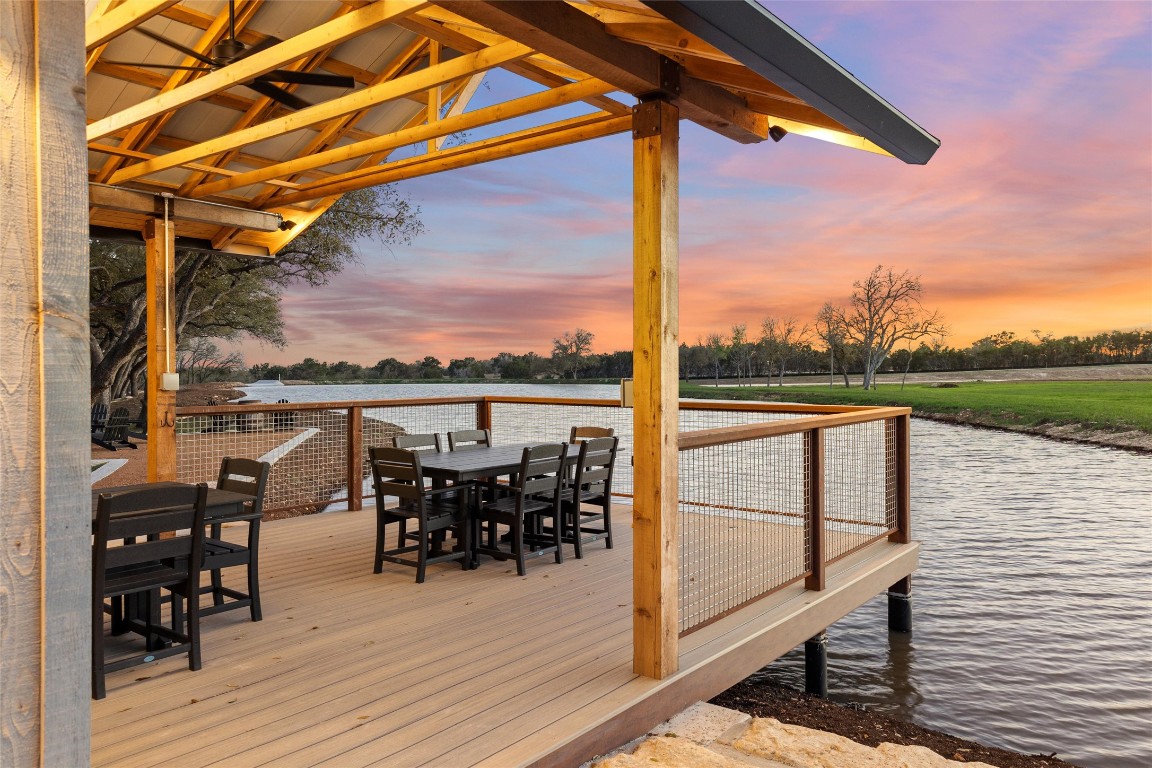 3516 Mt Sharp Road, Unit 23 Wimberley, TX 78676 - Photo 27 of 40 a view of a balcony with chairs and wooden floor