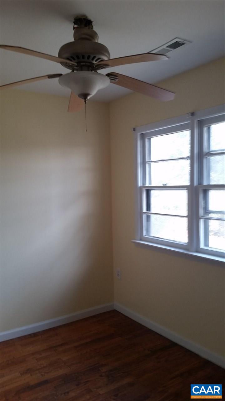 575 Resettlement Road Madison, VA 22727 - Photo 15 of 18 a view of a room with wooden floor and a window