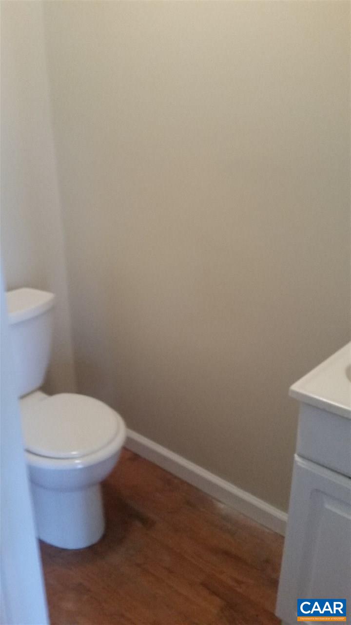 575 Resettlement Road Madison, VA 22727 - Photo 17 of 18 a white toilet sitting next to a shower
