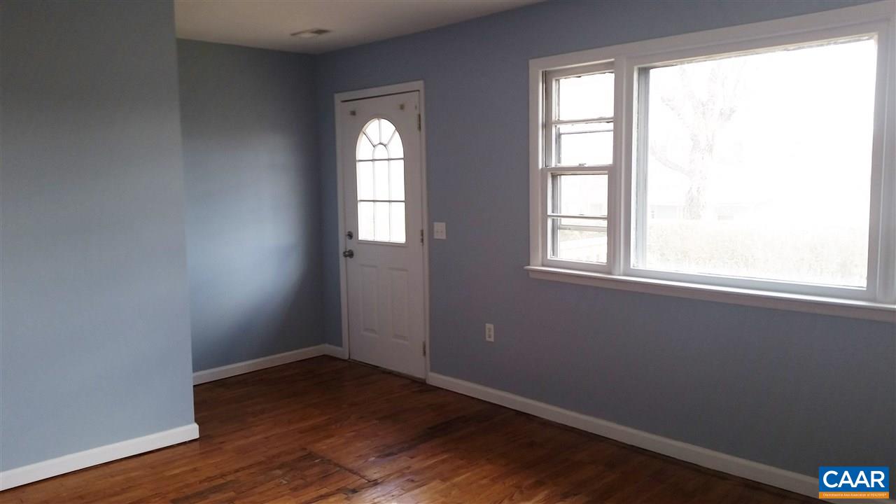 575 Resettlement Road Madison, VA 22727 - Photo 9 of 18 an empty room with wooden floor and windows