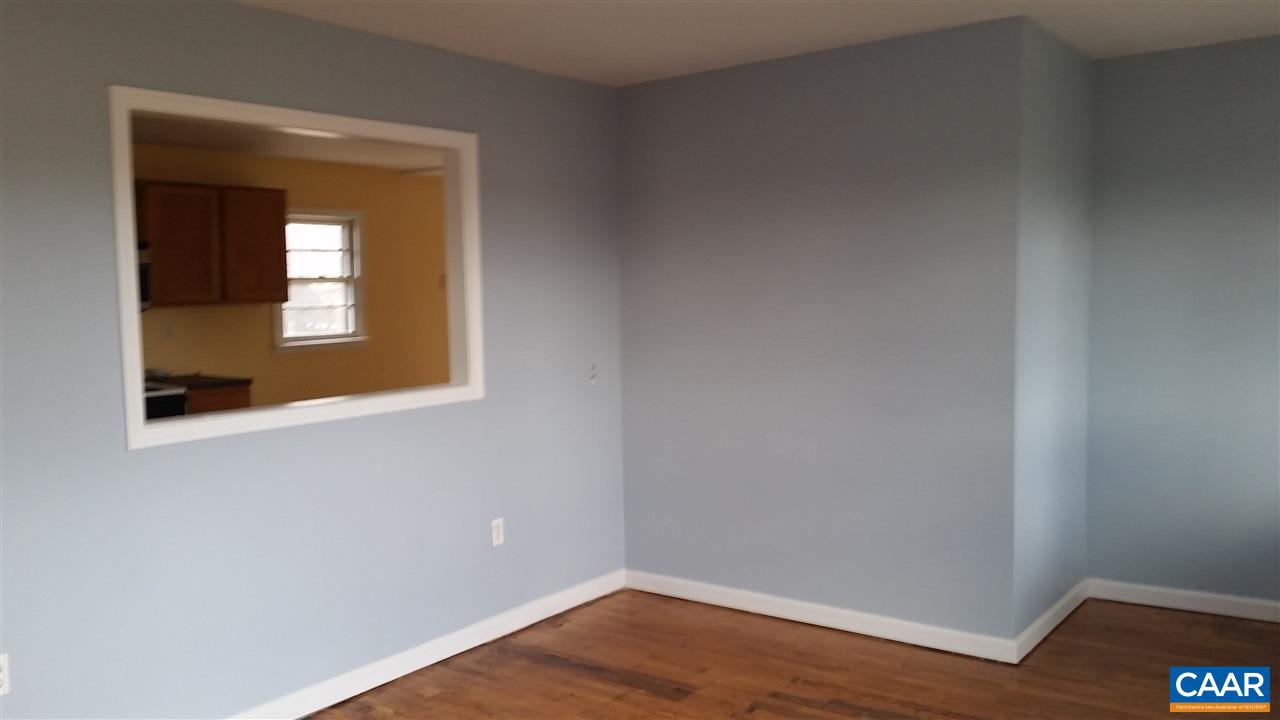 575 Resettlement Road Madison, VA 22727 - Photo 10 of 18 a view of an empty room with wooden floor and a window