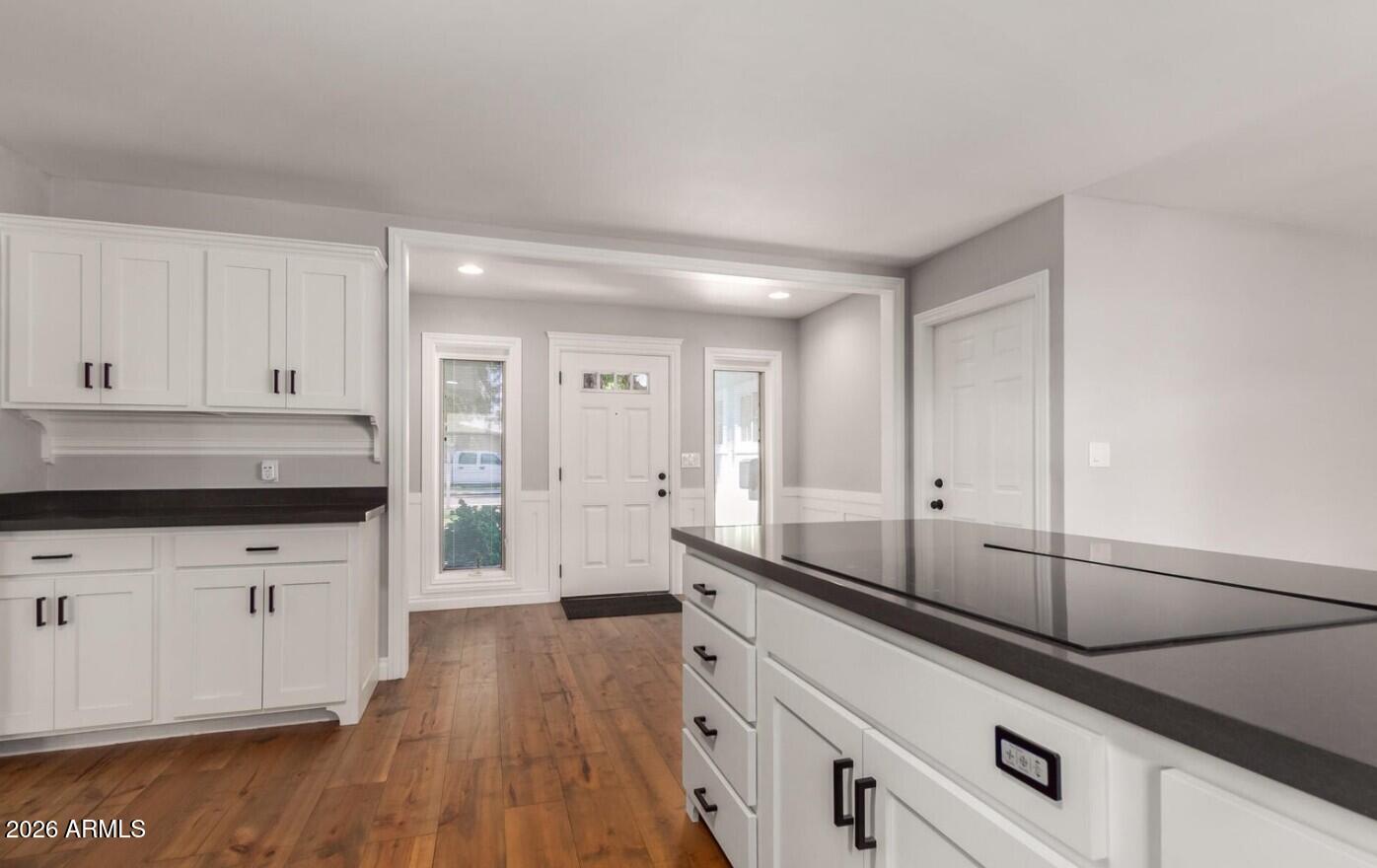 607 West 15th Street Tempe, AZ 85281 - Photo 6 of 29 a kitchen with granite countertop white cabinets and white appliances