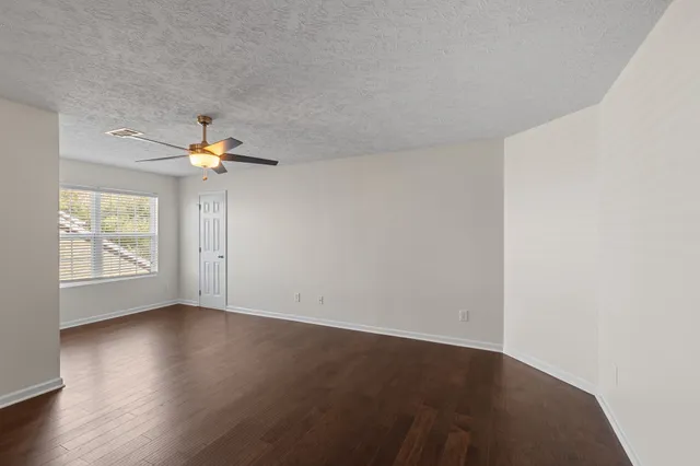 a view of kitchen with wooden floor and window