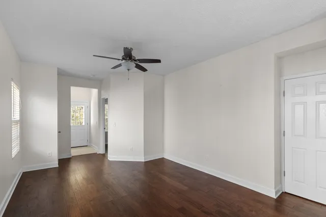 a view of an entryway with wooden floor