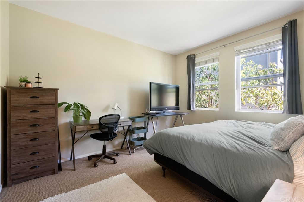 2321 Scholarship Irvine, CA 92612 - Photo 13 of 34 a bedroom with a bed and a desk