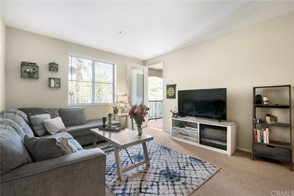 2321 Scholarship Irvine, CA 92612 - Photo 18 of 34 a living room with furniture and a flat screen tv