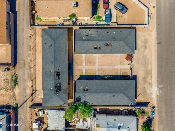 an aerial view of residential houses with outdoor space
