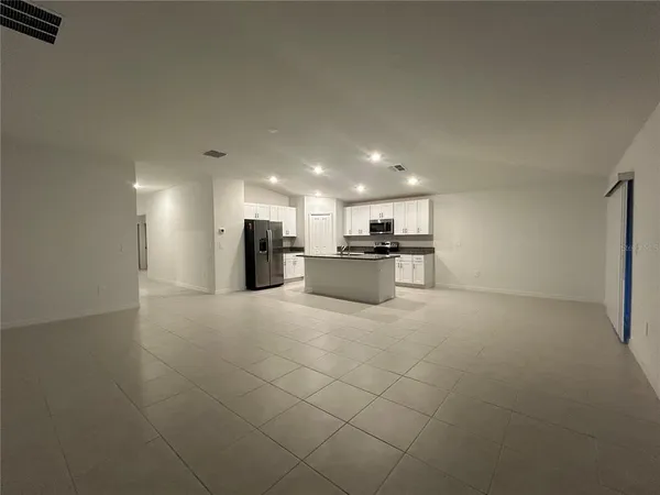 a view of kitchen appliances with cabinets