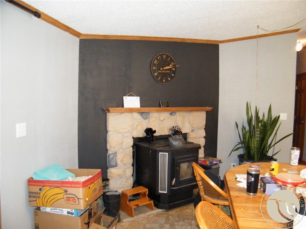 101 Smith Road Roundup, MT 59072 - Photo 9 of 28 Pellet stove in dining area