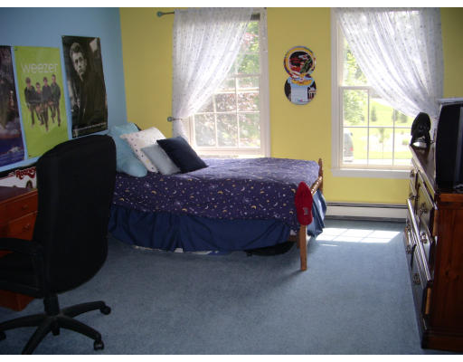 18 Old Town Road Beverly, MA 01915 - Photo 16 of 18 a bed sitting in a bedroom next to a window