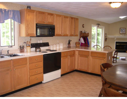 18 Old Town Road Beverly, MA 01915 - Photo 6 of 18 a kitchen with a sink cabinets and window