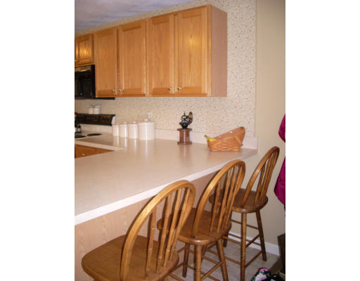 18 Old Town Road Beverly, MA 01915 - Photo 8 of 18 a kitchen with a table and chairs in it