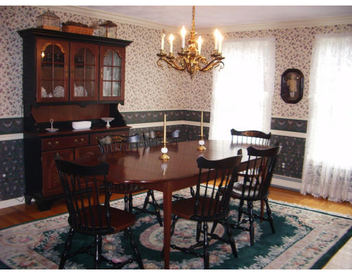 18 Old Town Road Beverly, MA 01915 - Photo 9 of 18 a view of a dining room with furniture and chandelier