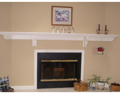 18 Old Town Road Beverly, MA 01915 - Photo 10 of 18 a living room with furniture and a fireplace