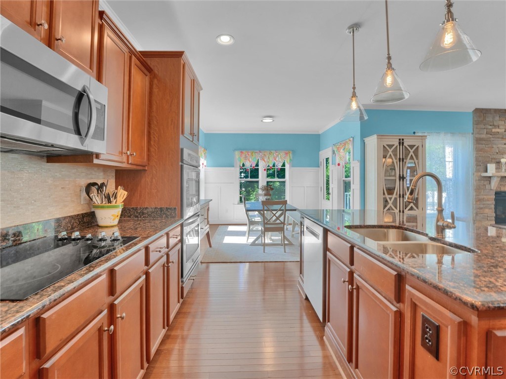 2842 Bayfront Way Midlothian, VA 23112 - Photo 17 of 50 a kitchen with stainless steel appliances granite countertop a sink stove and refrigerator