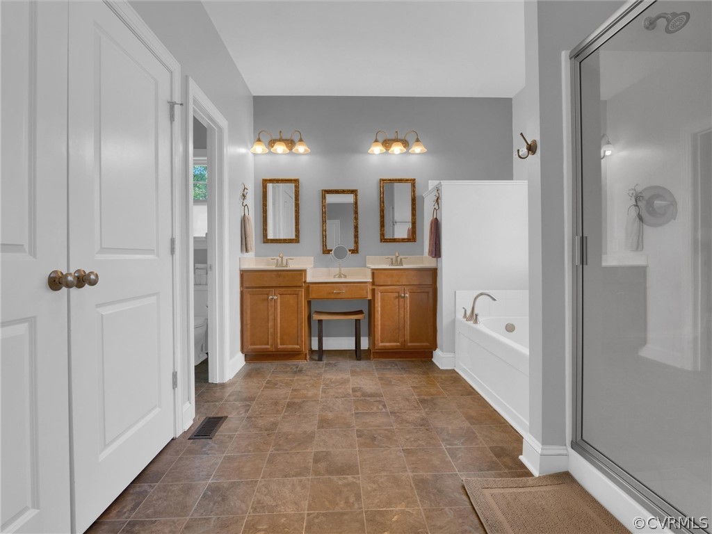 2842 Bayfront Way Midlothian, VA 23112 - Photo 26 of 50 a large bathroom with a glass shower door a sink a mirror and a bathtub
