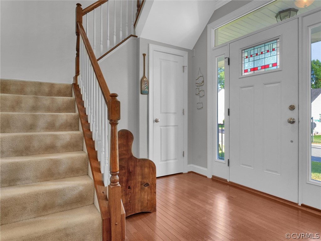 2842 Bayfront Way Midlothian, VA 23112 - Photo 34 of 50 a view of staircase with wooden floor and chair