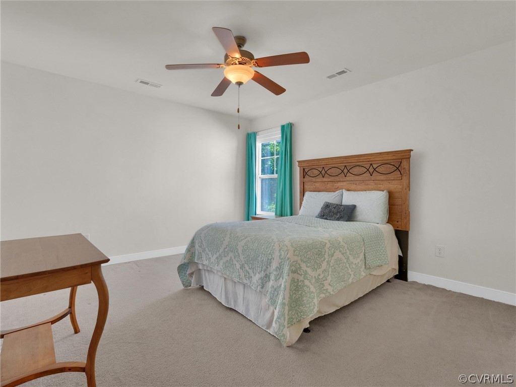 2842 Bayfront Way Midlothian, VA 23112 - Photo 36 of 50 a bedroom with a bed and a ceiling fan