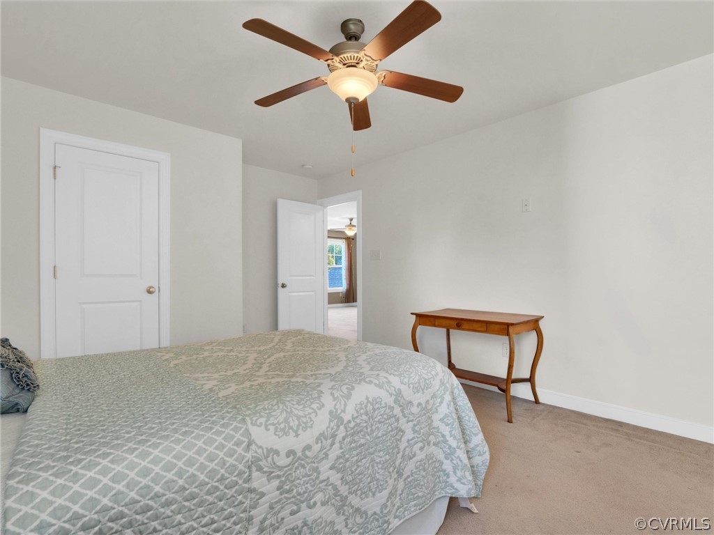 2842 Bayfront Way Midlothian, VA 23112 - Photo 37 of 50 a bedroom with a bed and a chandelier