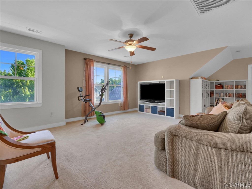 2842 Bayfront Way Midlothian, VA 23112 - Photo 41 of 50 a living room with furniture a flat screen tv and a window