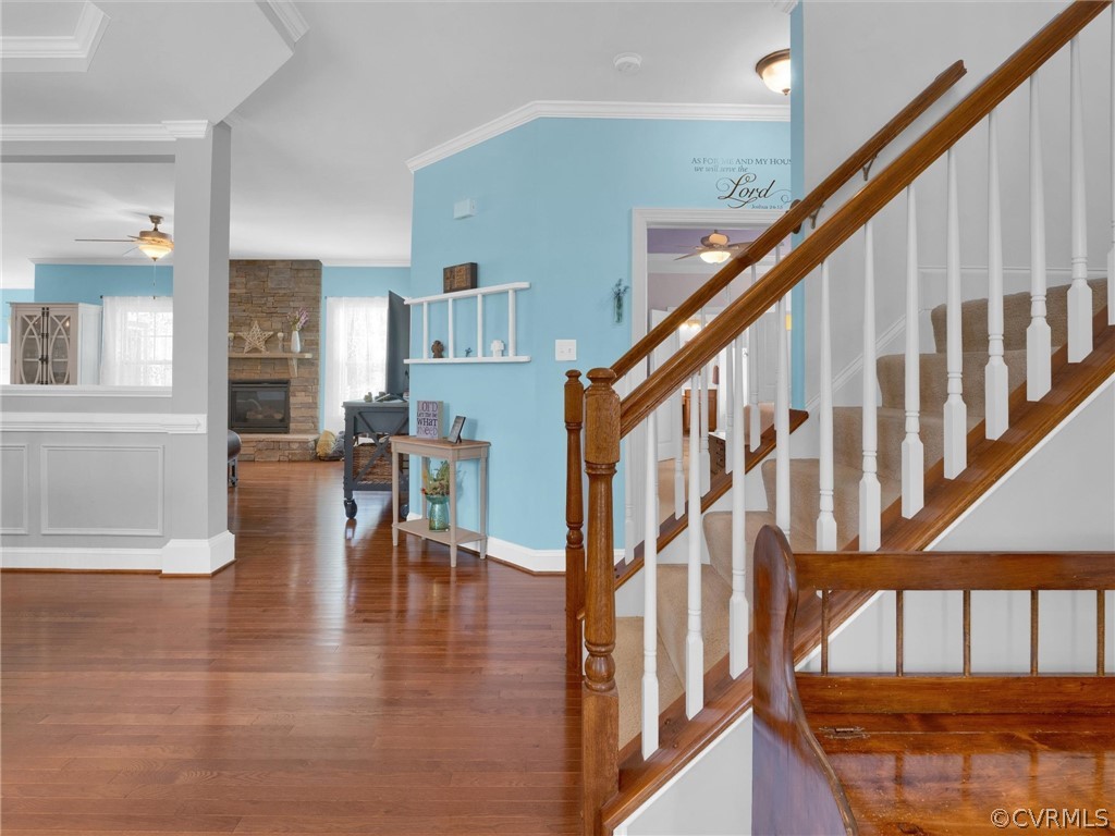 2842 Bayfront Way Midlothian, VA 23112 - Photo 5 of 50 a view of staircase with lots of frames on wall and wooden floor