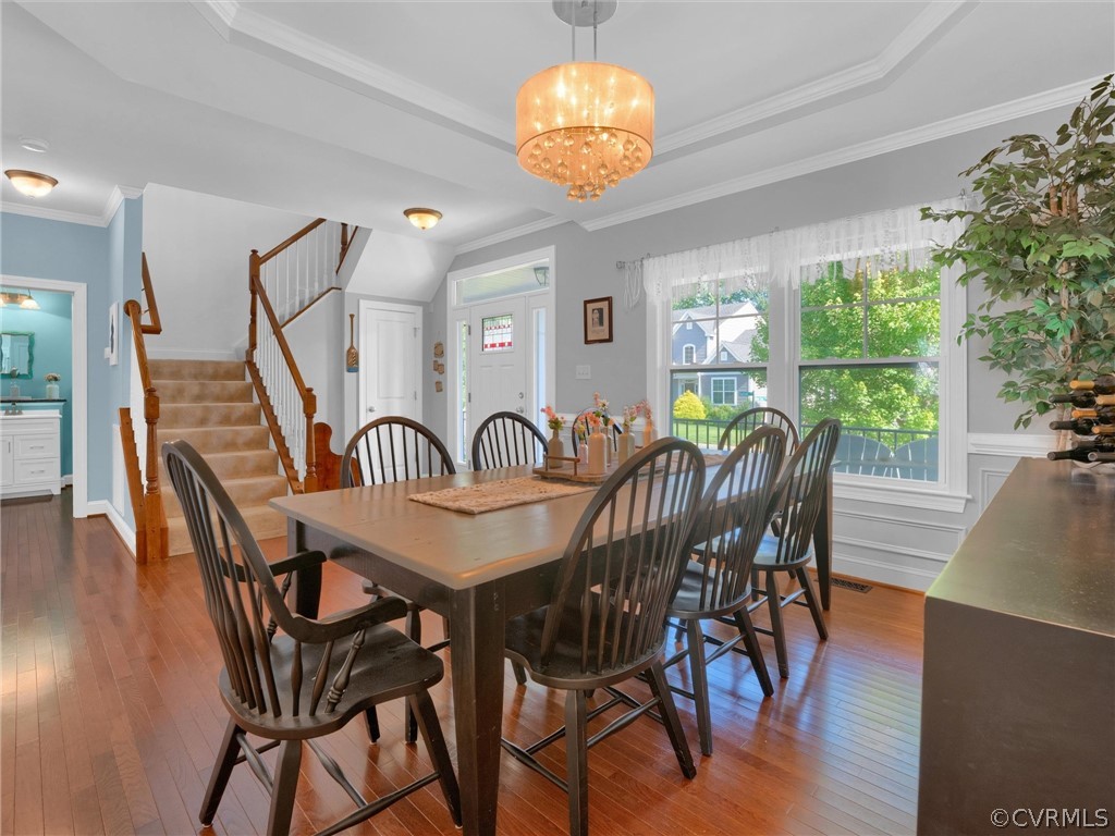 2842 Bayfront Way Midlothian, VA 23112 - Photo 7 of 50 a view of a dining room with furniture wooden floor and chandelier