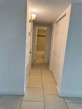 a bathroom with a sink a toilet and a shower