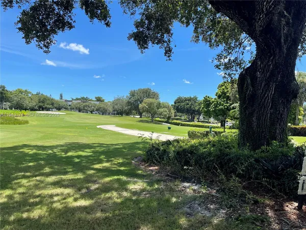 a view of a garden with an ocean