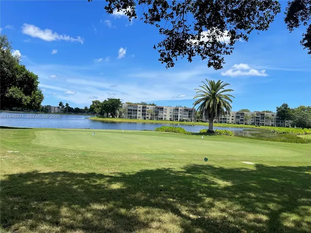 a view of a swimming pool and an outdoor space