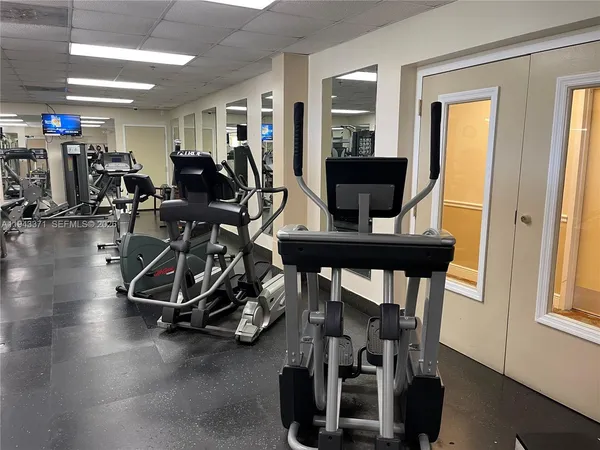 a room with gym equipment and window