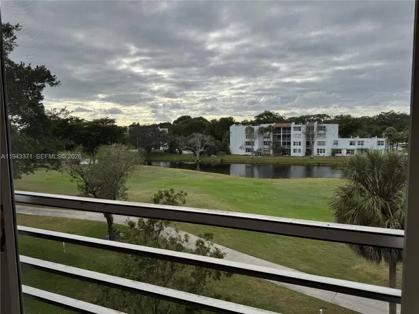 a view of a yard from a balcony