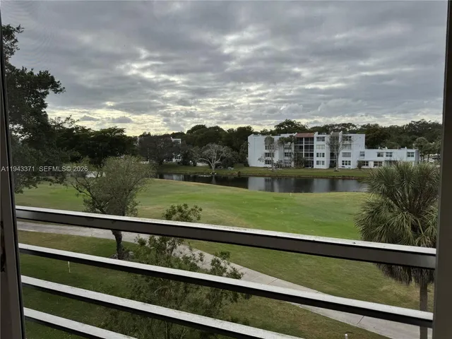 a view of a yard from a balcony