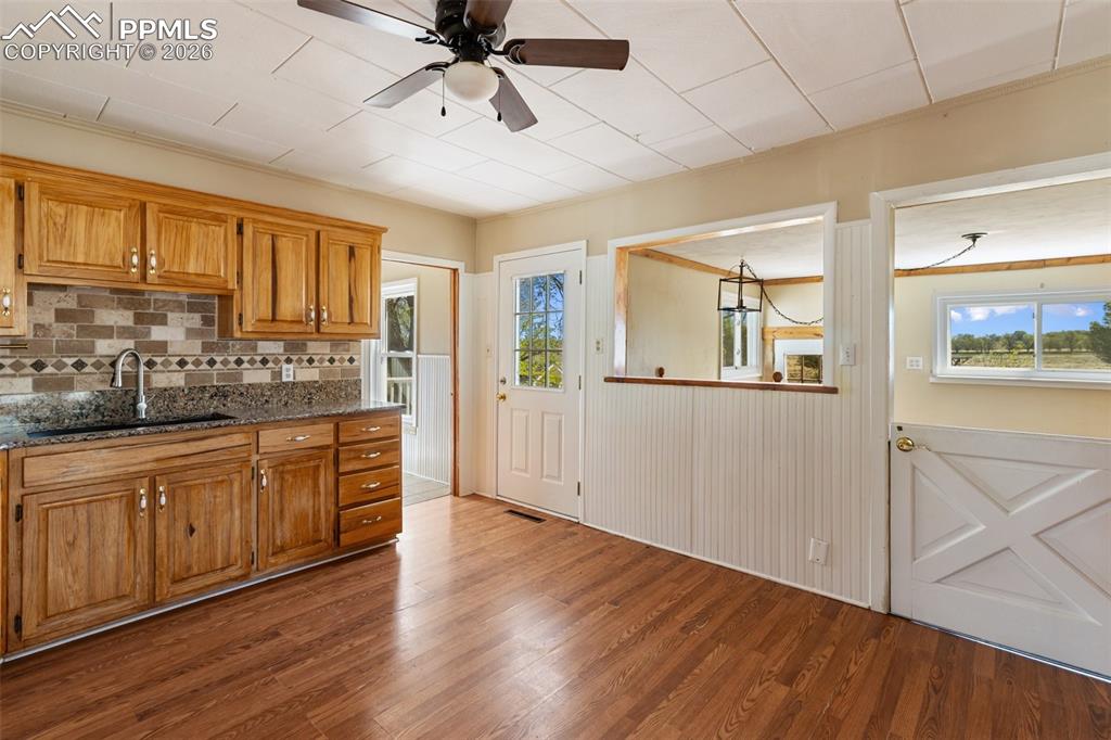 10355 Link Road Fountain, CO 80817 - Photo 13 of 45 a large kitchen with a lot of counter space and wooden floor
