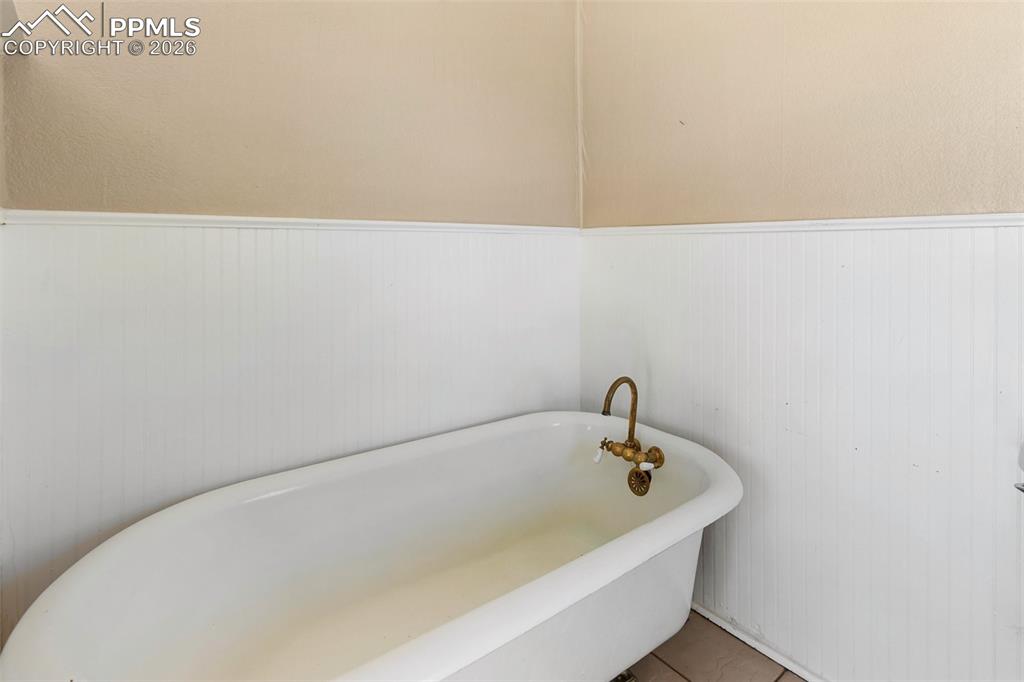 10355 Link Road Fountain, CO 80817 - Photo 17 of 45 a white bath tub sitting in a bathroom