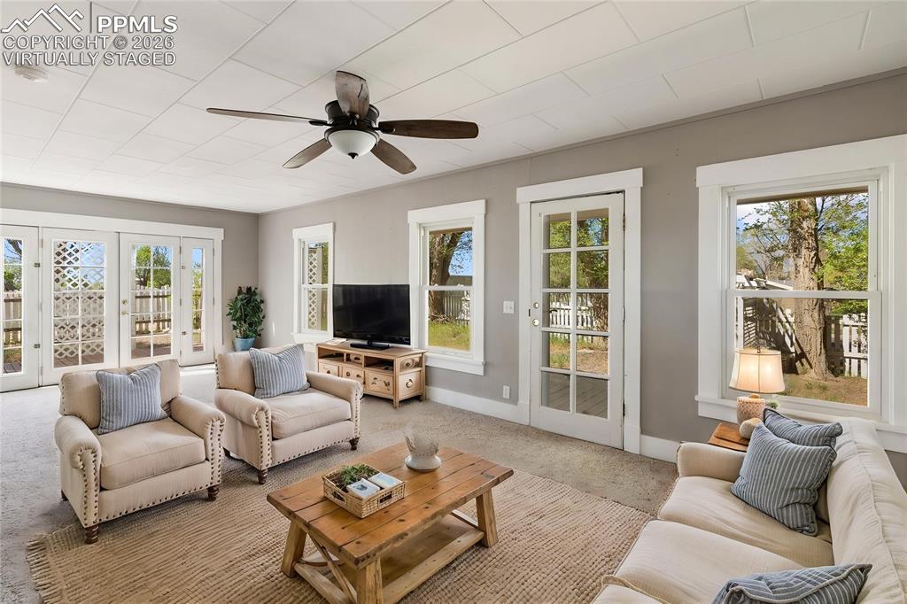 10355 Link Road Fountain, CO 80817 - Photo 19 of 45 a living room with furniture and a flat screen tv