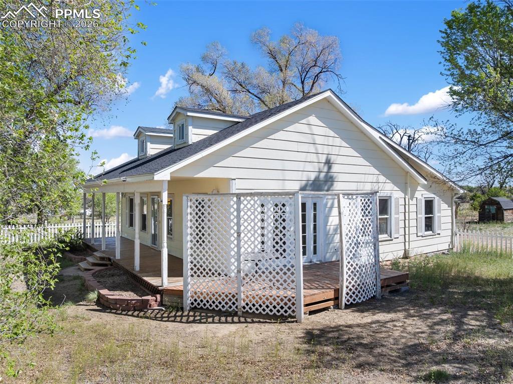 10355 Link Road Fountain, CO 80817 - Photo 2 of 45 a view of a house with a small yard and floor to ceiling window