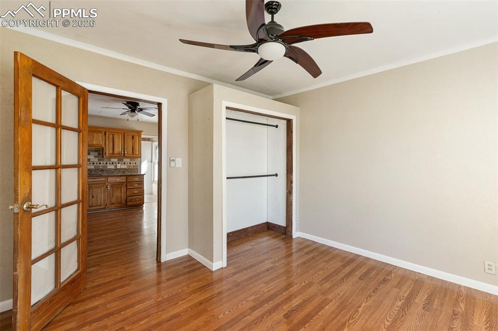 10355 Link Road Fountain, CO 80817 - Photo 30 of 45 a view of empty room with wooden floor and fan