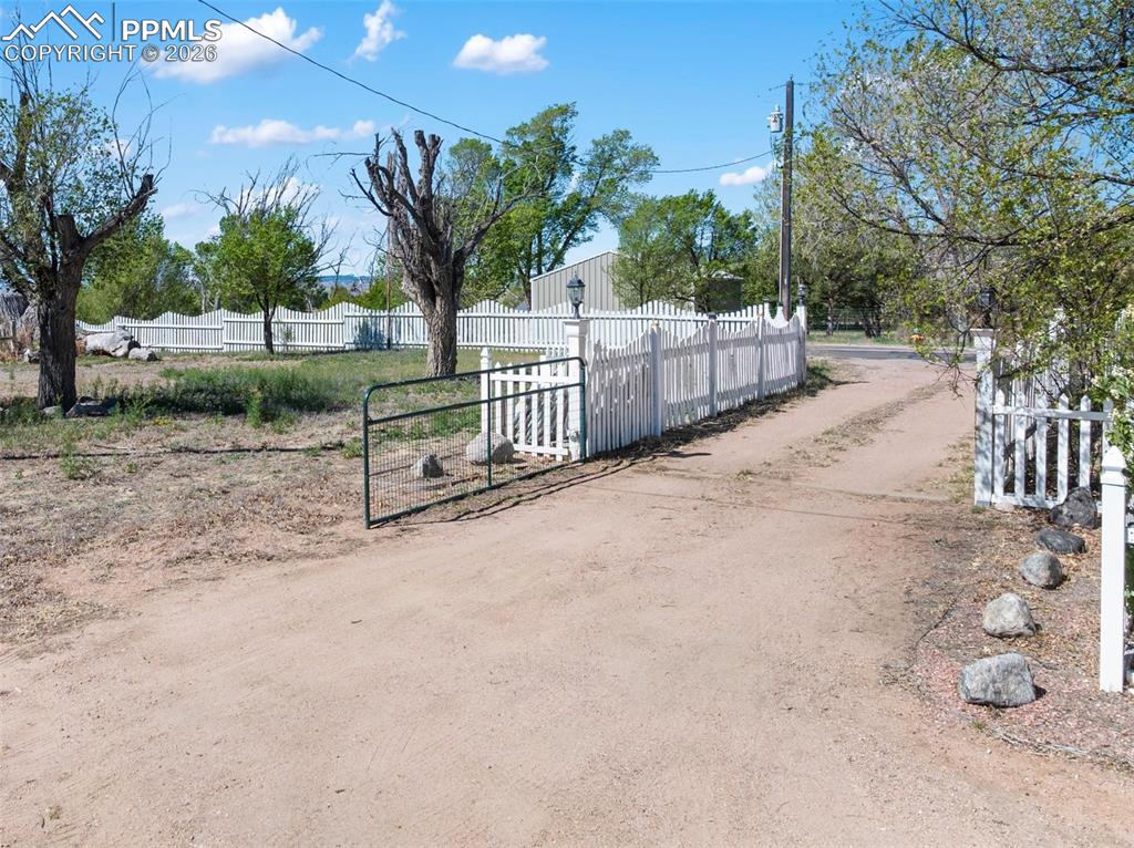 10355 Link Road Fountain, CO 80817 - Photo 3 of 45 a view of backyard and tree