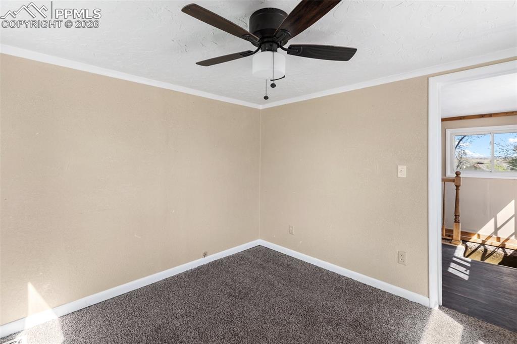 10355 Link Road Fountain, CO 80817 - Photo 31 of 45 a view of a livingroom with a chandelier fan